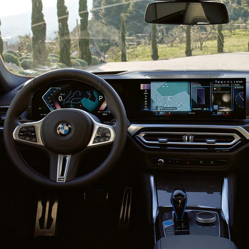 A driver's eye view of steering wheel and controls of the BMW i4 | BMW of Bakersfield in Bakersfield CA